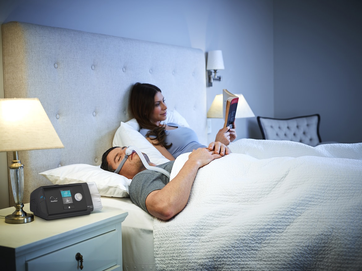 CPAP Couple sleep and read